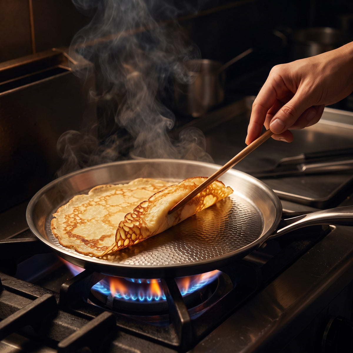 Hatori Kōmyō 光明 Series – Hammered Titanium Crêpe Pan, in use on the stove