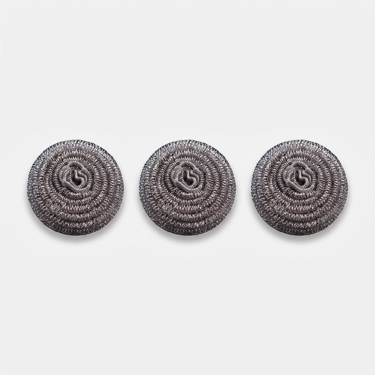 Hatori Titanium Pan Scrubbers, Set of 3, on light grey