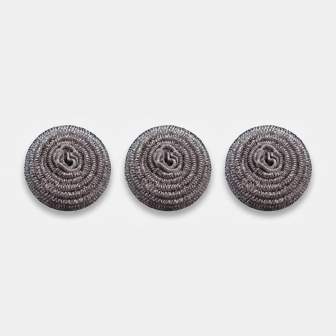 Hatori Titanium Pan Scrubbers, Set of 3, on light grey