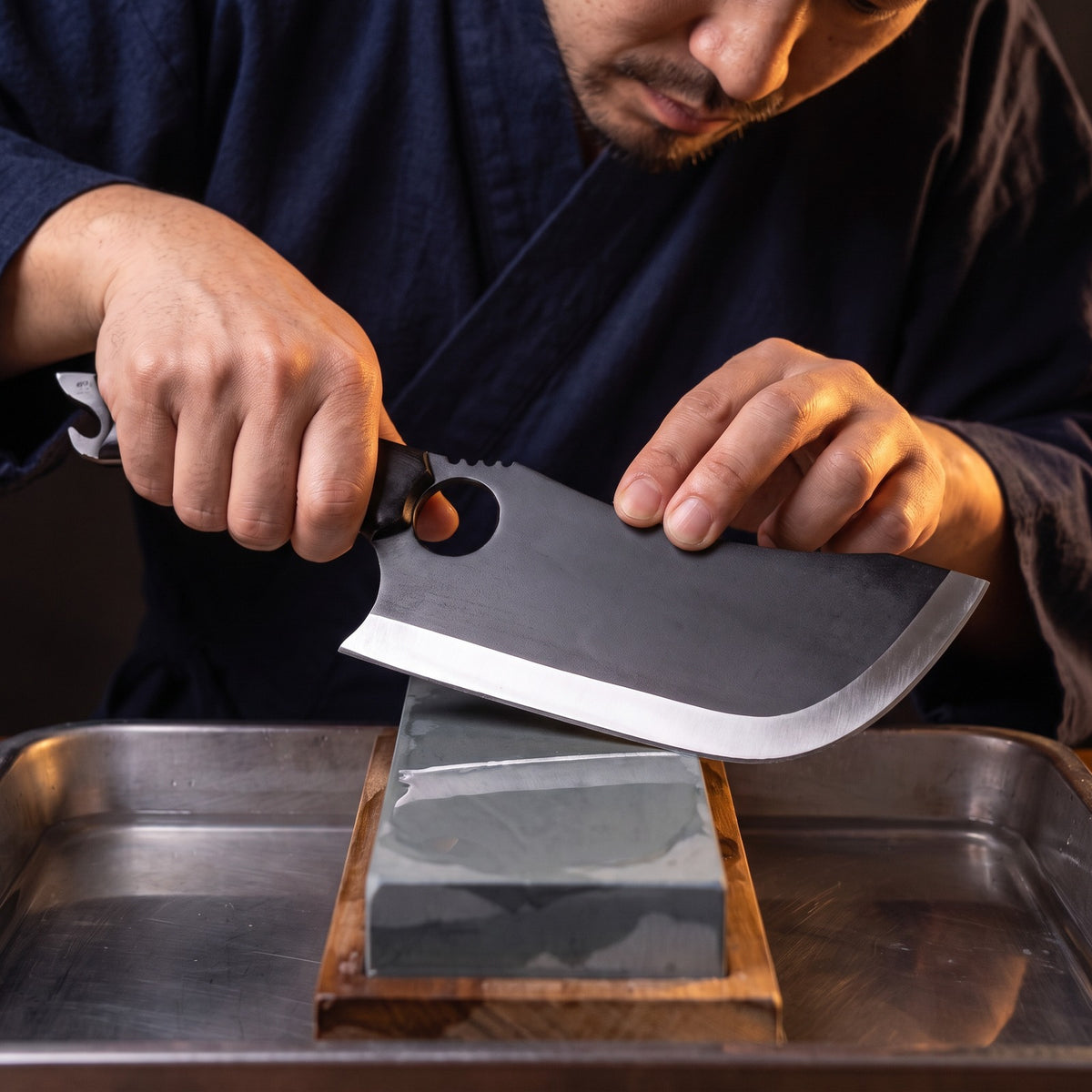 Hatori Kiba 牙 Series – Black Forged Ring Knife 16 cm, on the whetstone